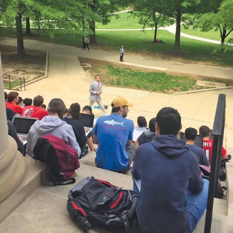 History students have class on the steps of Francis Scott Key Hall