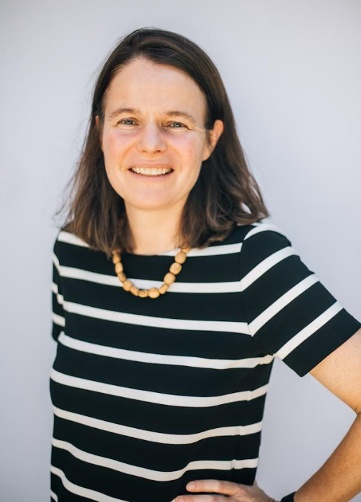 Headshot of Sarah Cameron in a striped shirt. 